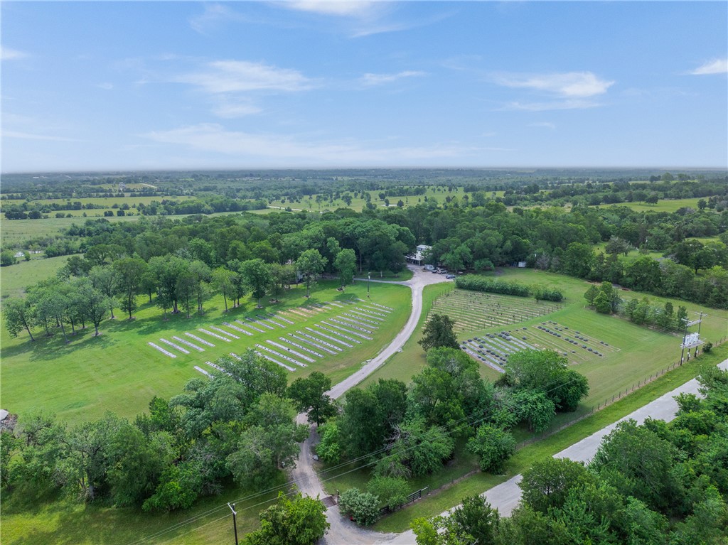 2250 Dillard Road Washington, TX 77880 - Photo 34 of 50 an aerial view of a golf course with a lake view