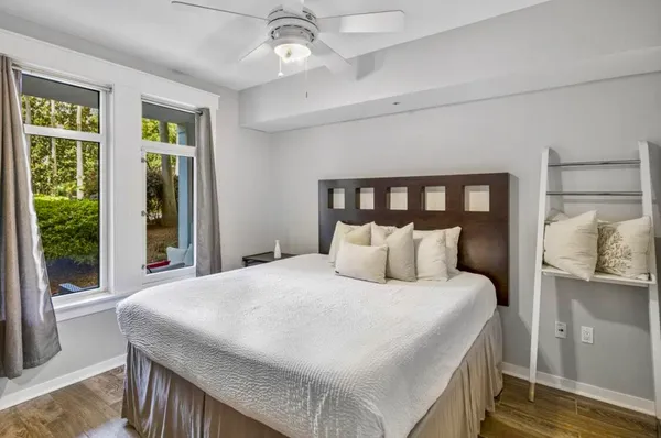 a bedroom with a large bed and a window