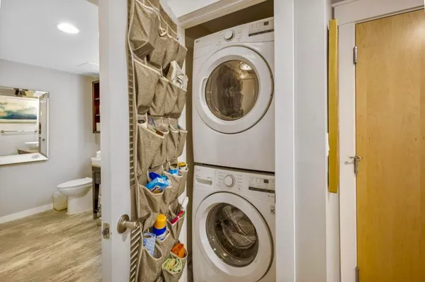a view of a hallway with washer and dryer