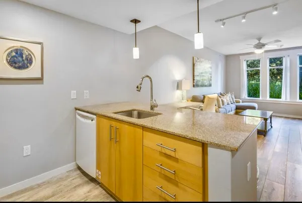 a kitchen with sink and window
