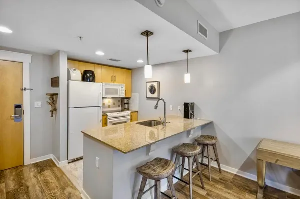 a kitchen with a table and chairs in it