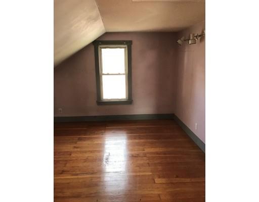 1241 Allen Street Springfield, MA 01118 - Photo 6 of 11 a view of an empty room with wooden floor and a window