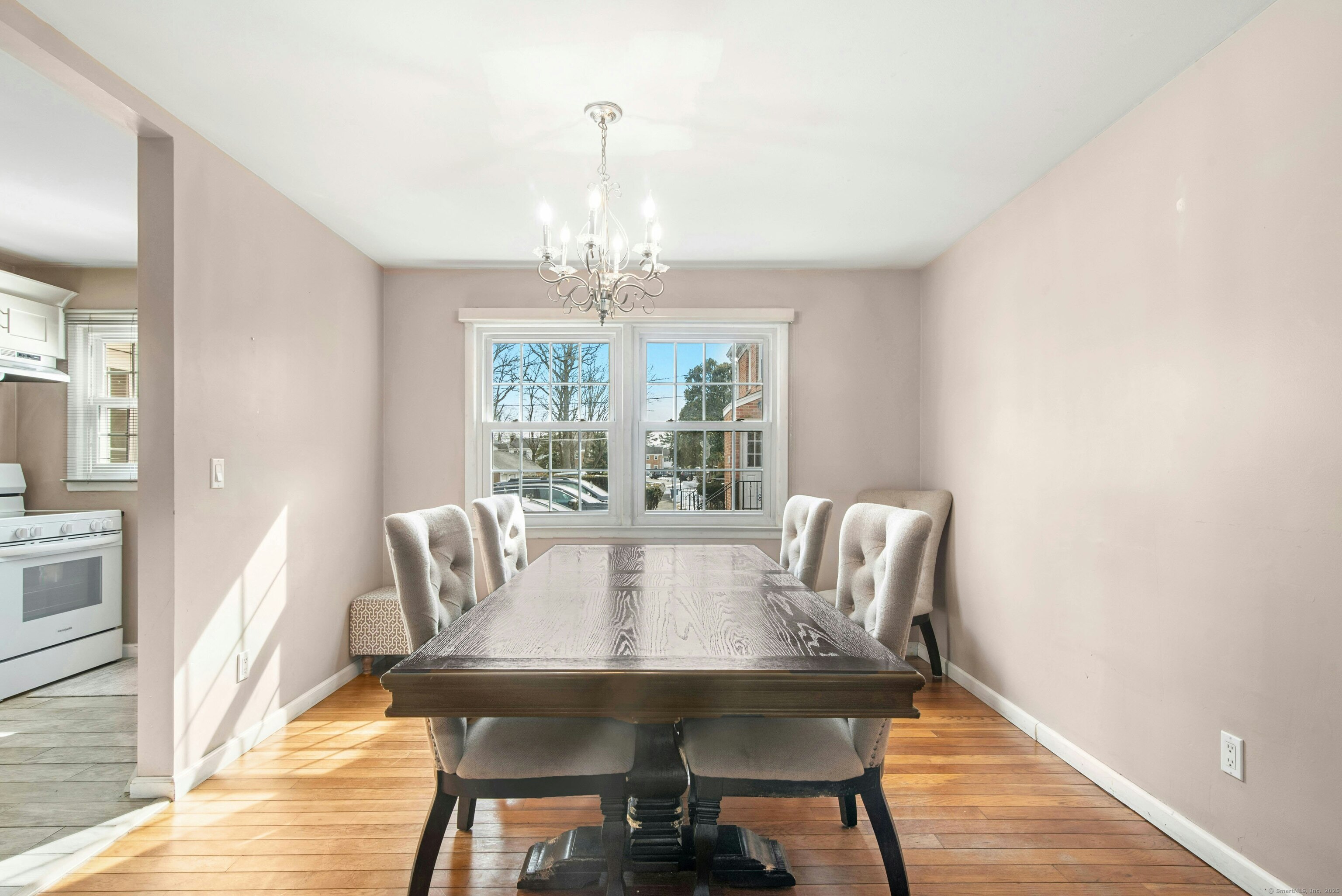 151 Heritage Hill Road, Unit B New Canaan, CT 06840 - Photo 4 of 12 a view of a dining room with furniture wooden floor and chandelier