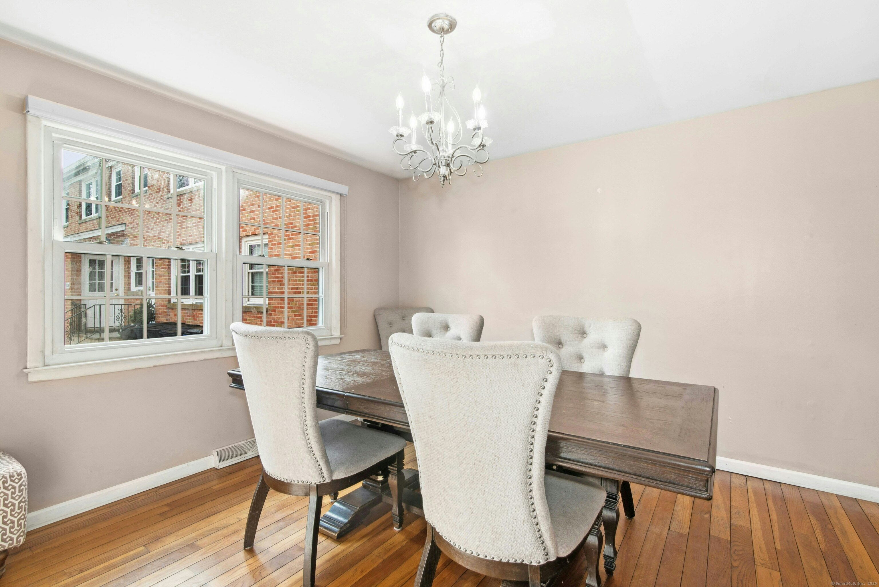 151 Heritage Hill Road, Unit B New Canaan, CT 06840 - Photo 5 of 12 a view of a dining room with furniture and wooden floor