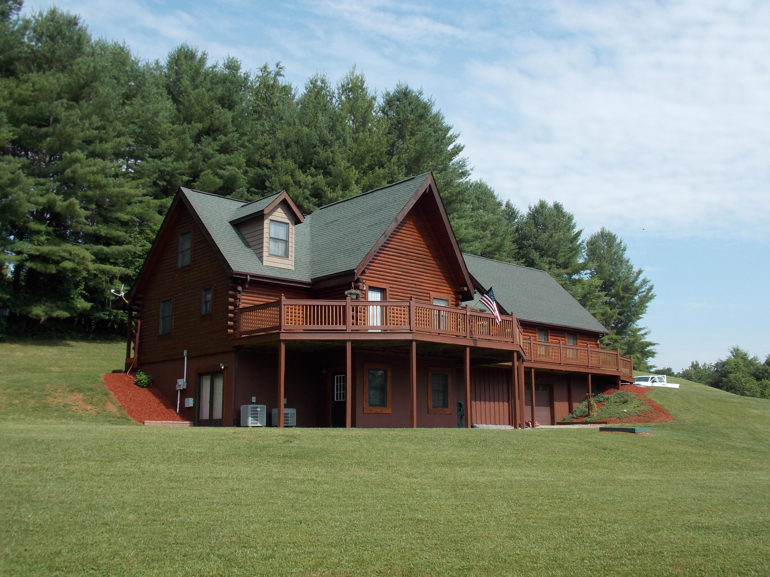 124 Ridgeview Road Northwest Floyd, VA 24091 - Photo 1 of 67 a front view of a house with a garden