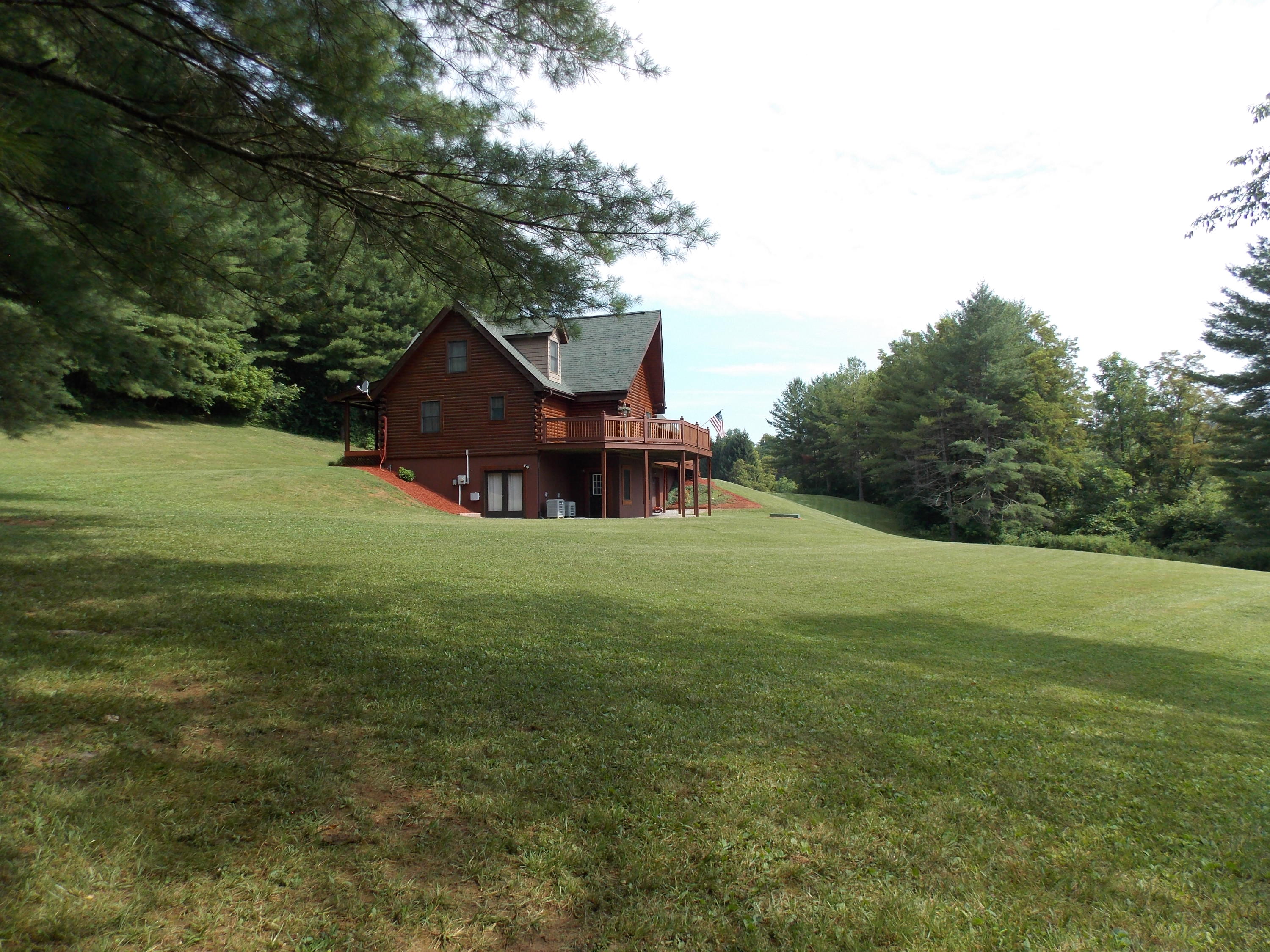 124 Ridgeview Road Northwest Floyd, VA 24091 - Photo 12 of 67 a aerial view of a house with a big yard potted plants and large tree