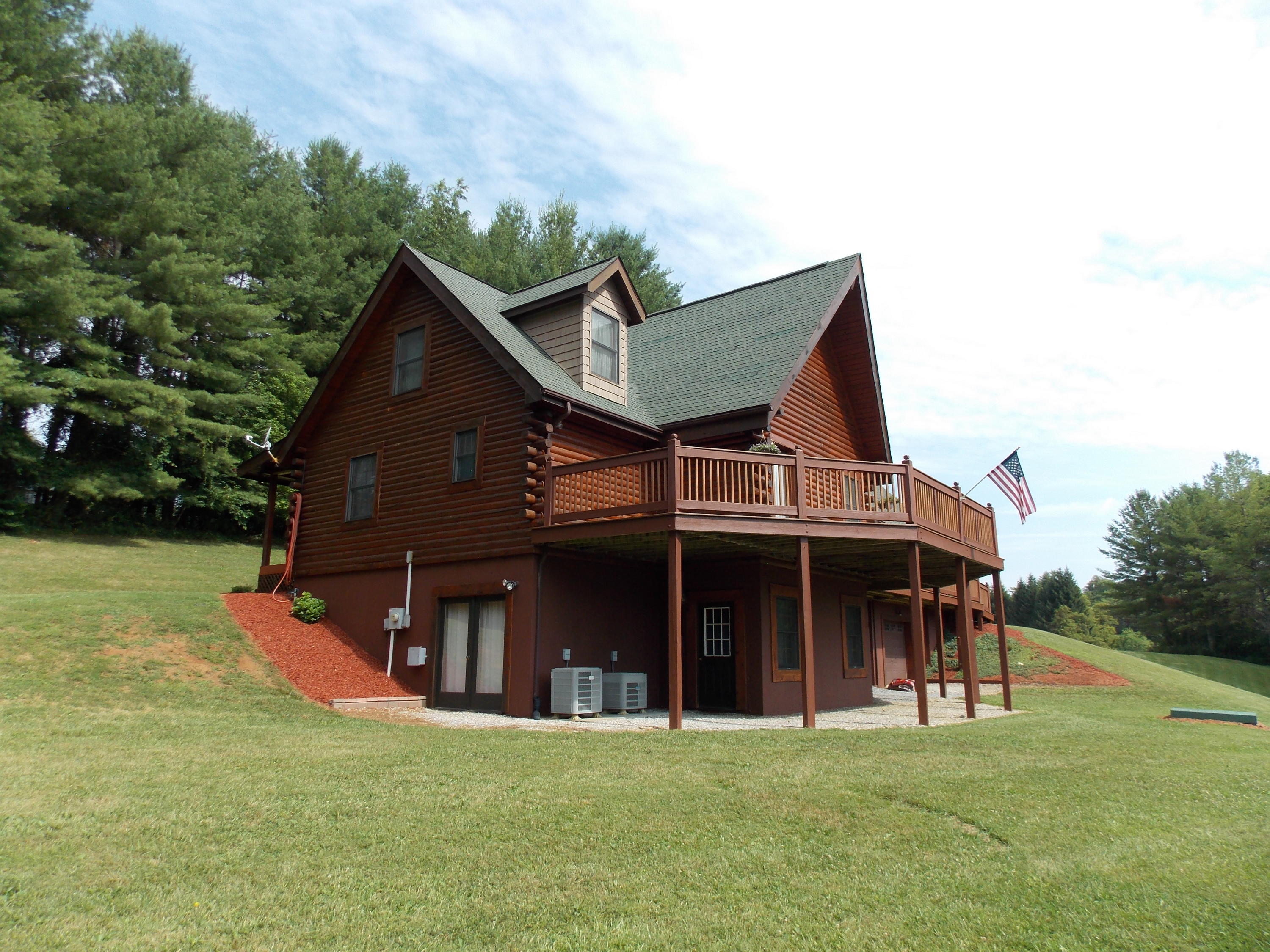 124 Ridgeview Road Northwest Floyd, VA 24091 - Photo 13 of 67 a view of a house with a yard and sitting area
