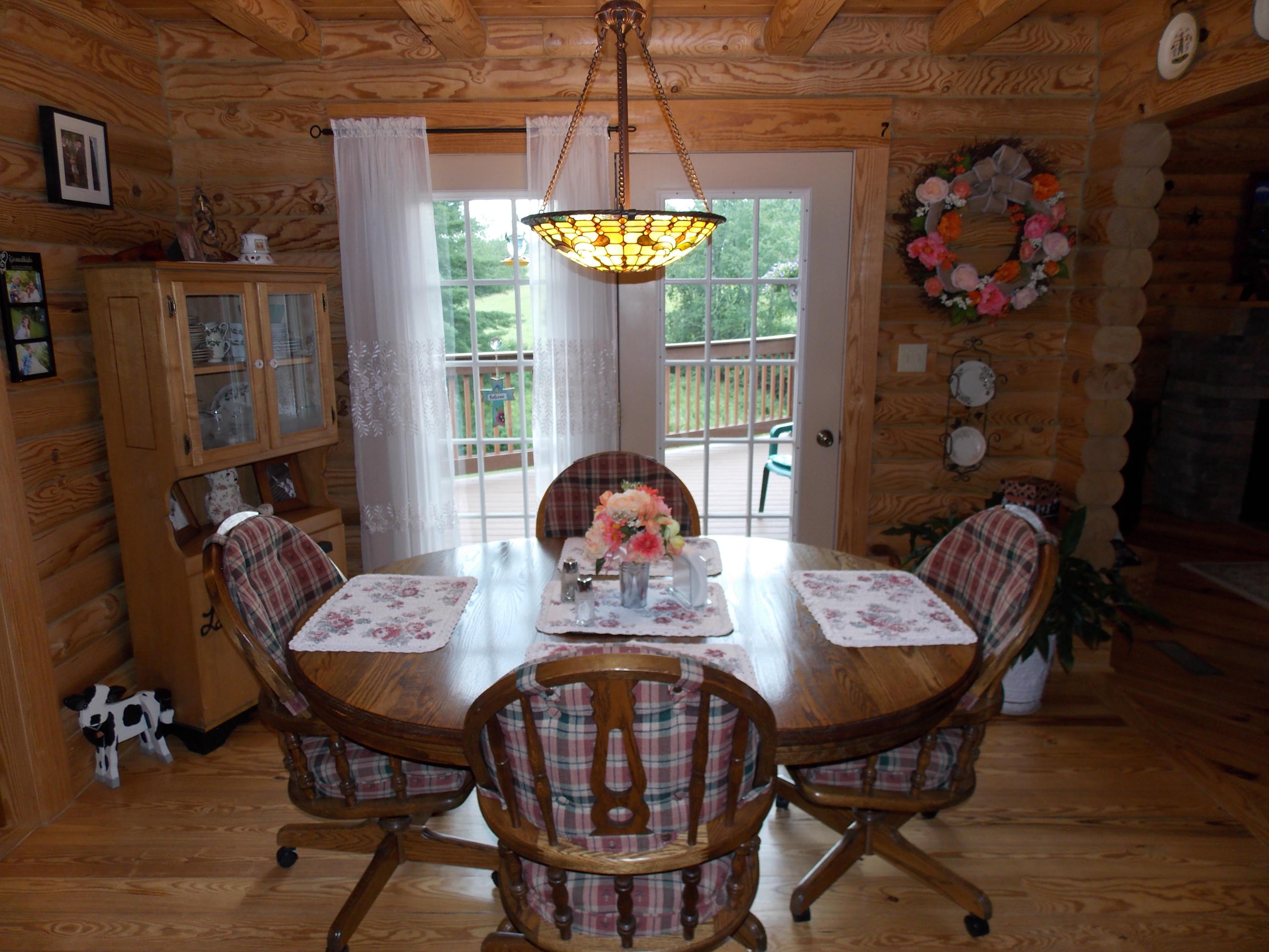 124 Ridgeview Road Northwest Floyd, VA 24091 - Photo 24 of 67 a view of a dining room with furniture and chandelier