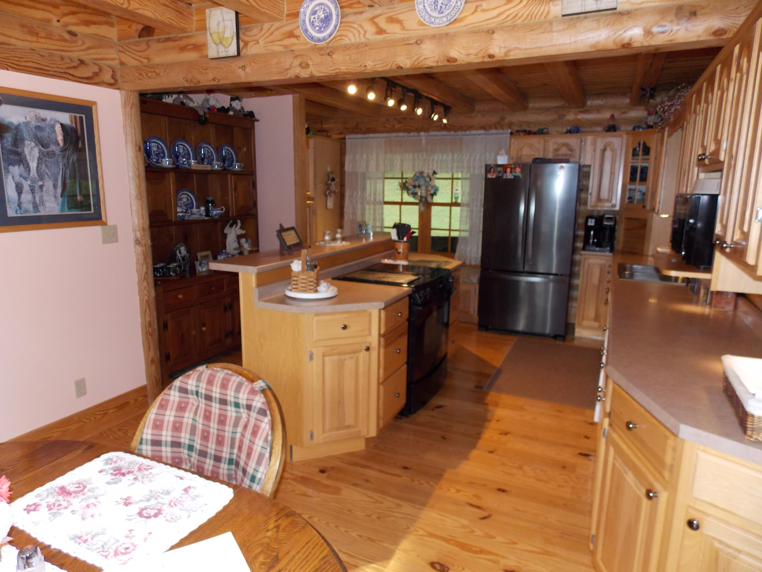 124 Ridgeview Road Northwest Floyd, VA 24091 - Photo 26 of 67 a kitchen with refrigerator and cabinets
