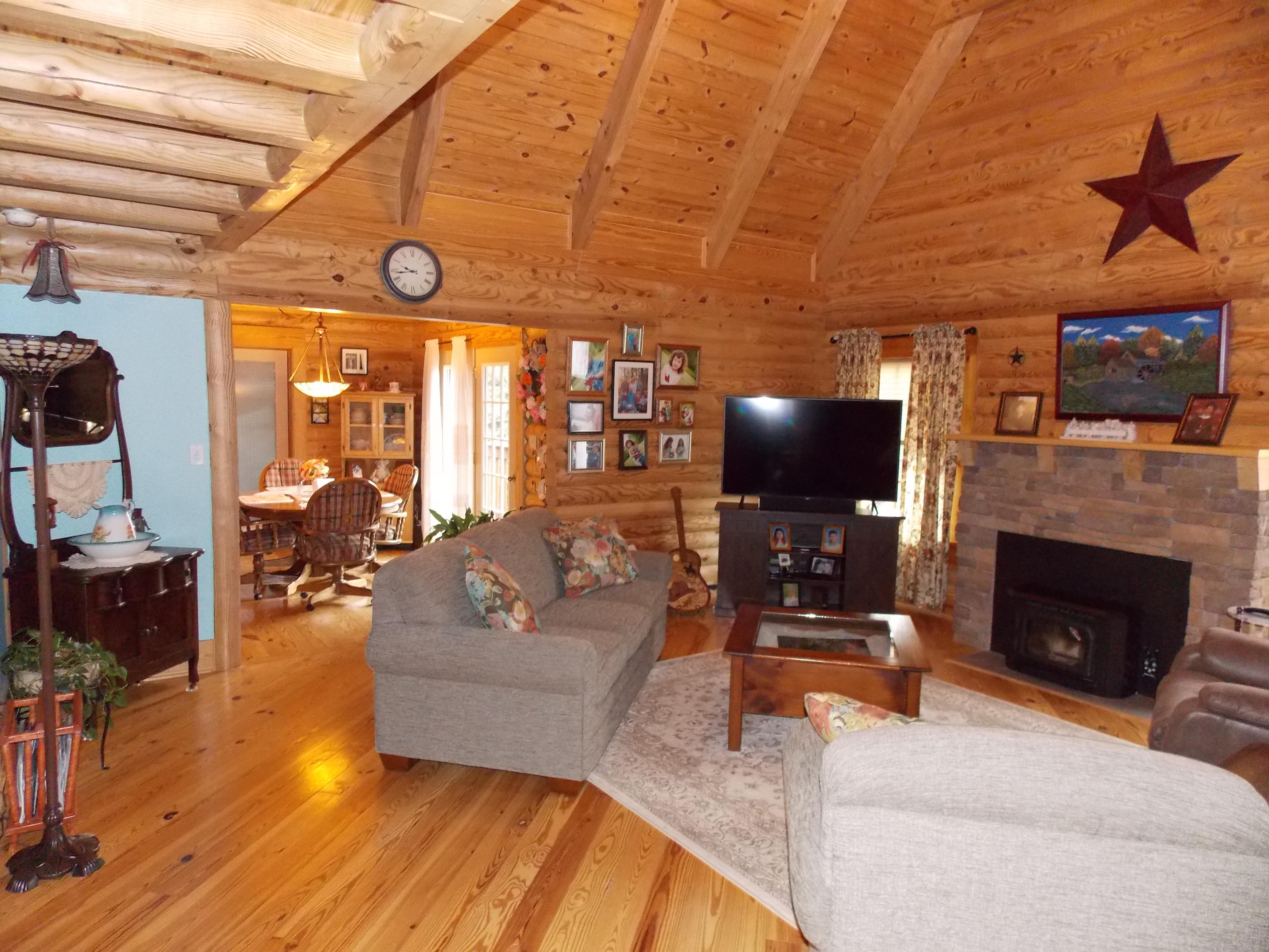 124 Ridgeview Road Northwest Floyd, VA 24091 - Photo 29 of 67 a living room with furniture a flat screen tv and a fireplace