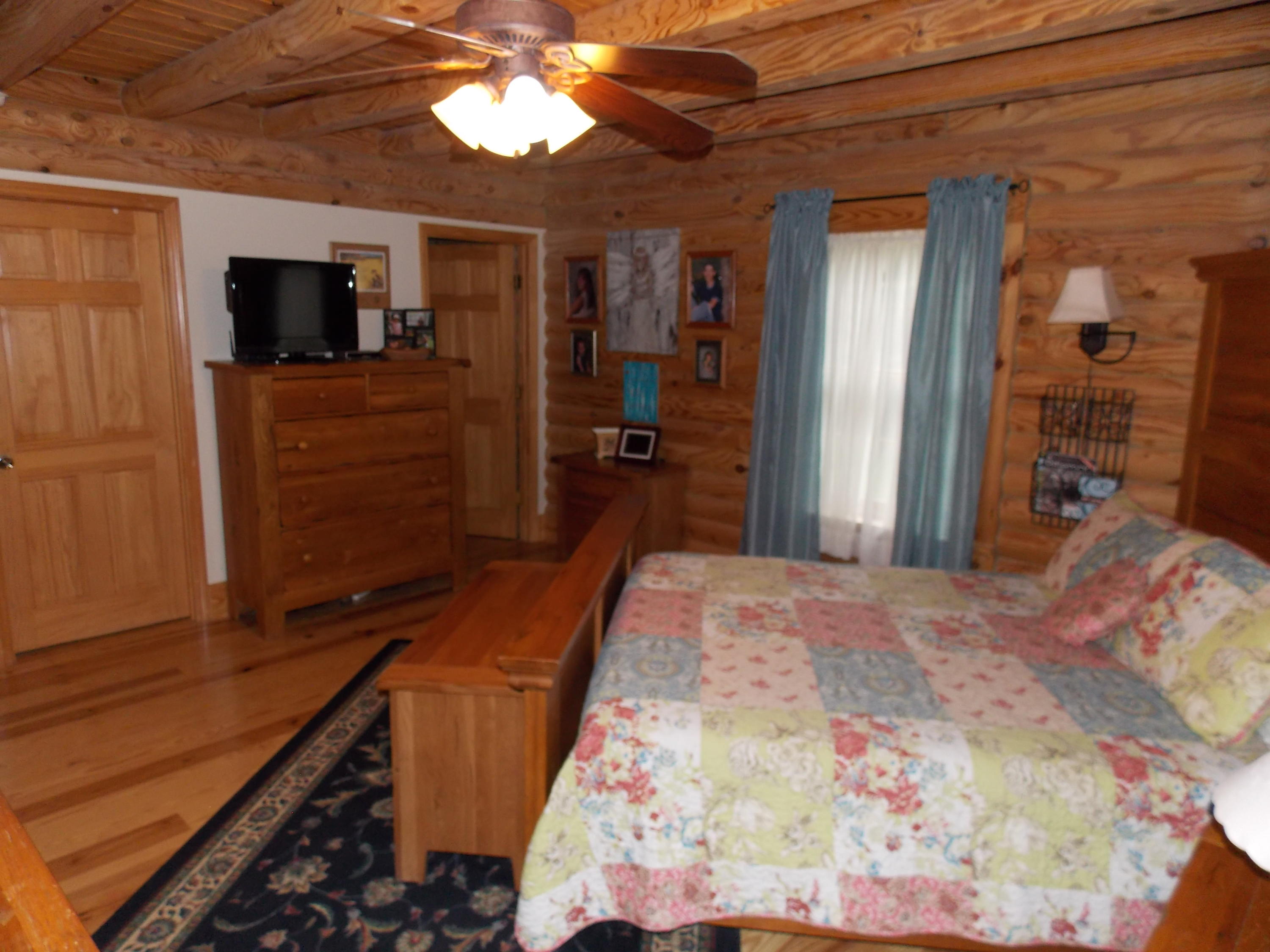 124 Ridgeview Road Northwest Floyd, VA 24091 - Photo 35 of 67 a bedroom with a bed and a flat tv screen on dresser