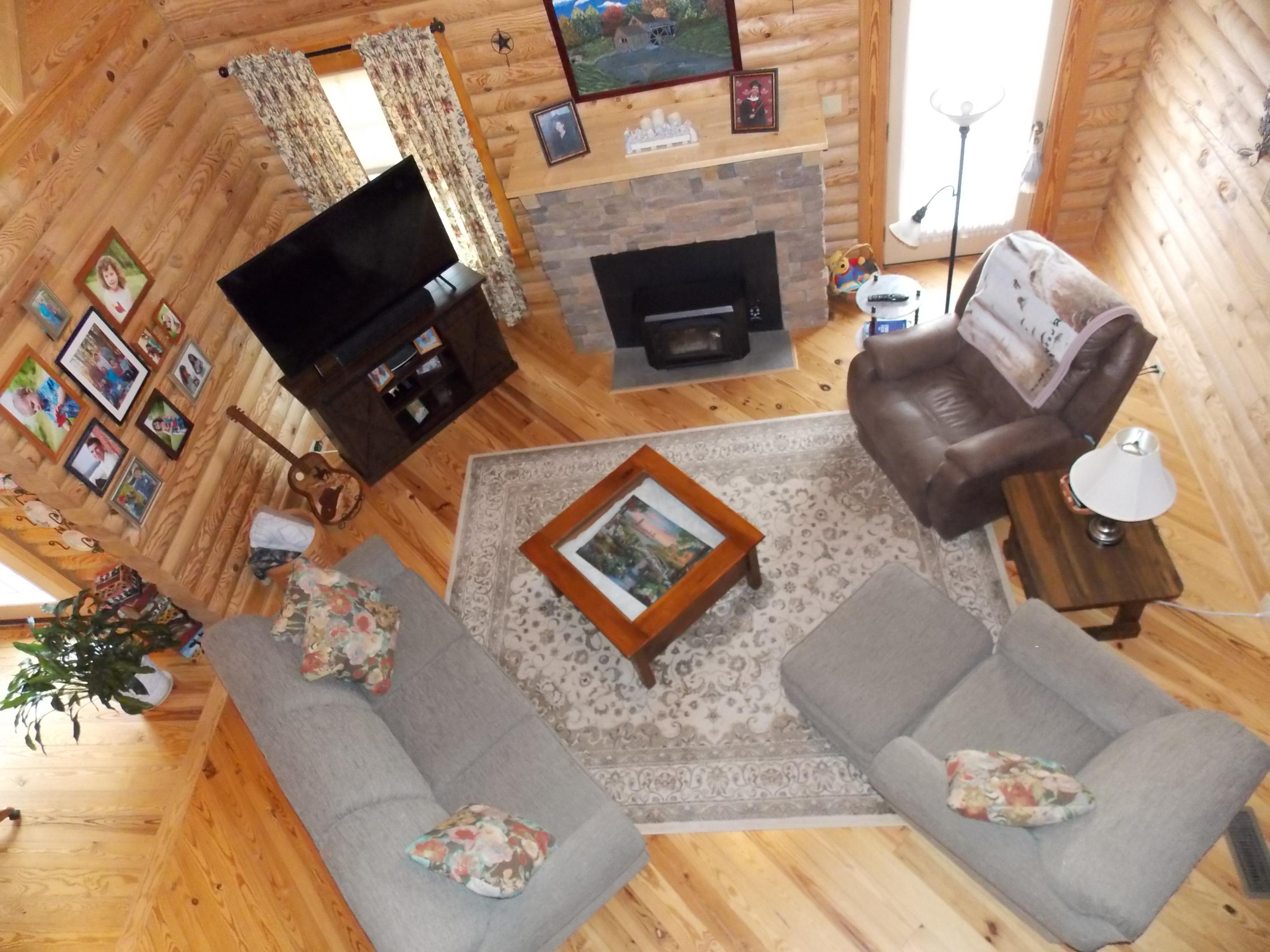 124 Ridgeview Road Northwest Floyd, VA 24091 - Photo 49 of 67 a living room with furniture a flat screen tv and a fireplace
