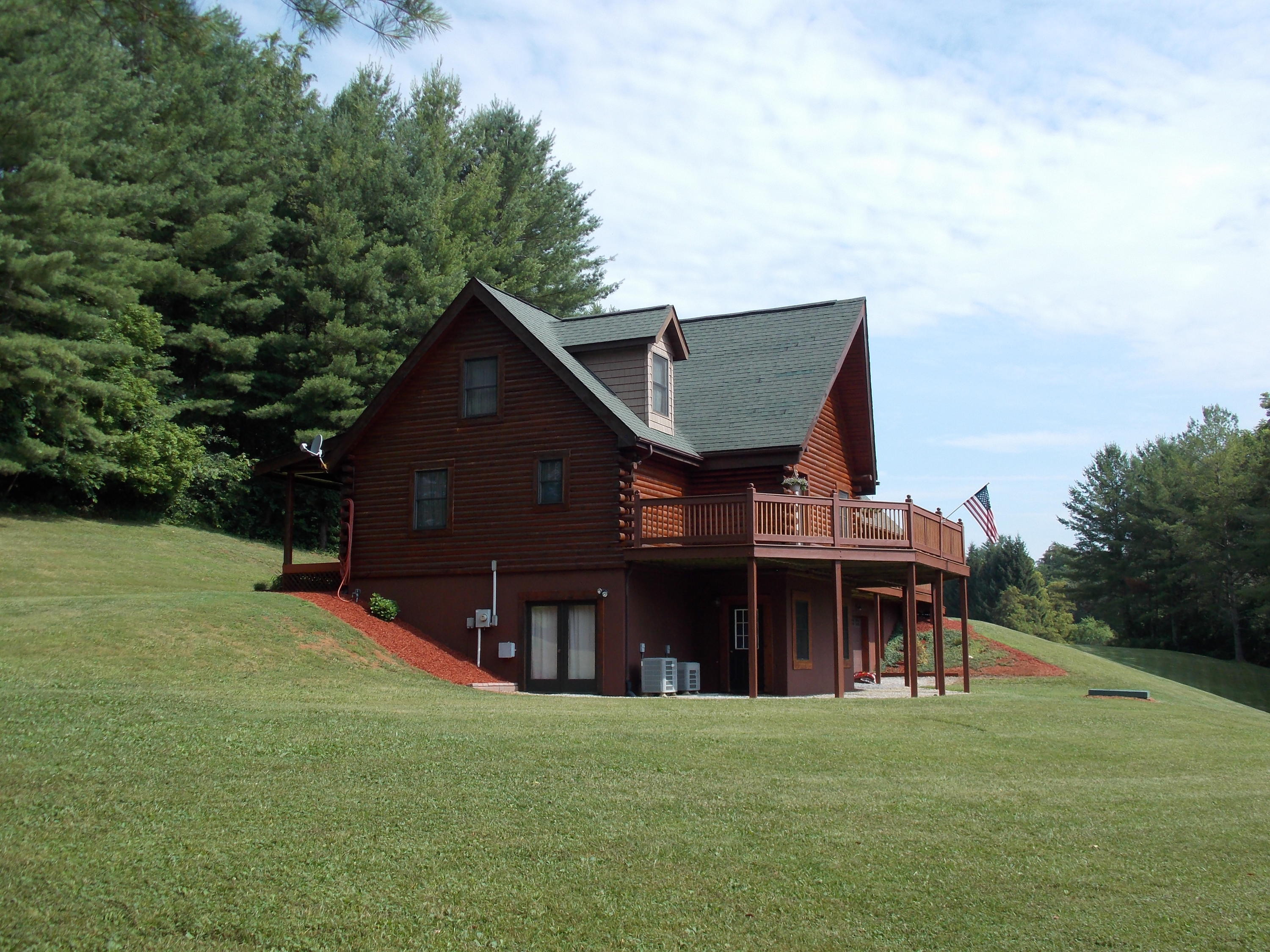 124 Ridgeview Road Northwest Floyd, VA 24091 - Photo 6 of 67 a view of house with outdoor space and garden
