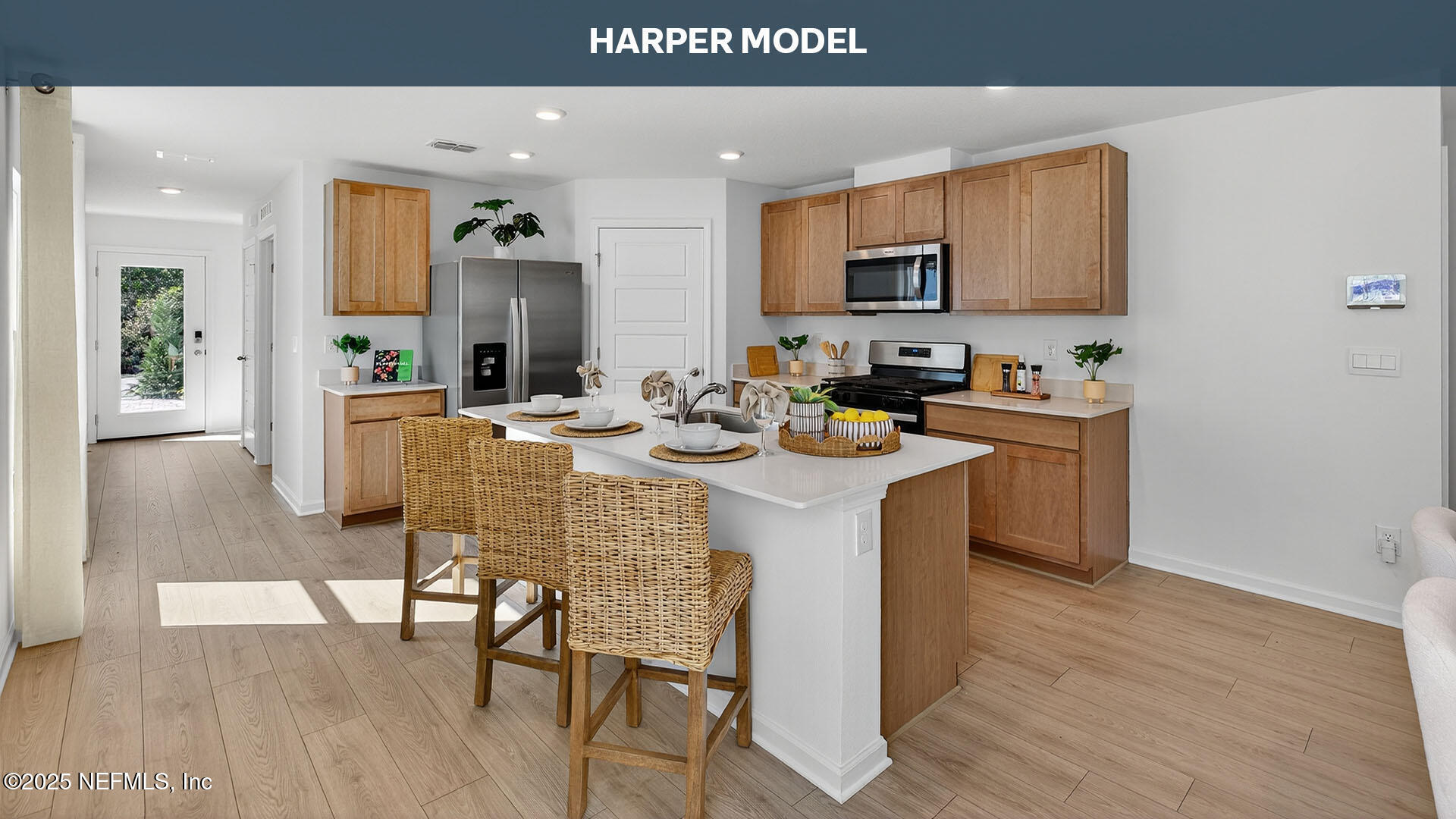32 Flagstick Lane Bunnell, FL 32110 - Photo 7 of 61 a dining hall with stainless steel appliances granite countertop a stove a sink dishwasher and a microwave oven with wooden floor