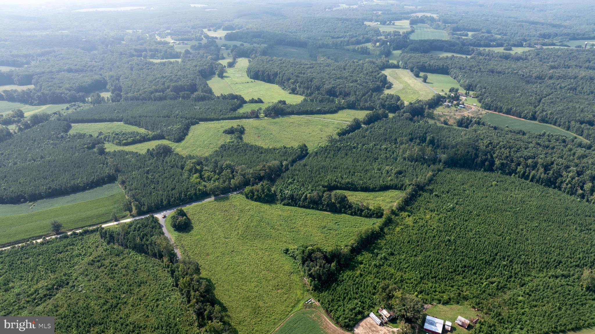 Tbd Trents Cemetery Road, Unit LOT 3 Phenix, VA 23959 - Photo 12 of 22 an aerial view of a house with a garden and lots of trees