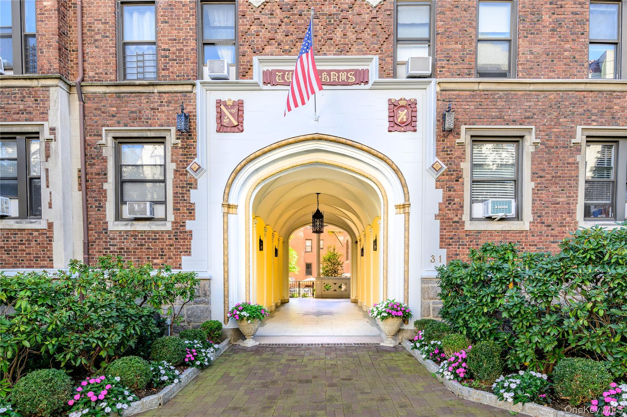 Property entrance featuring brick siding