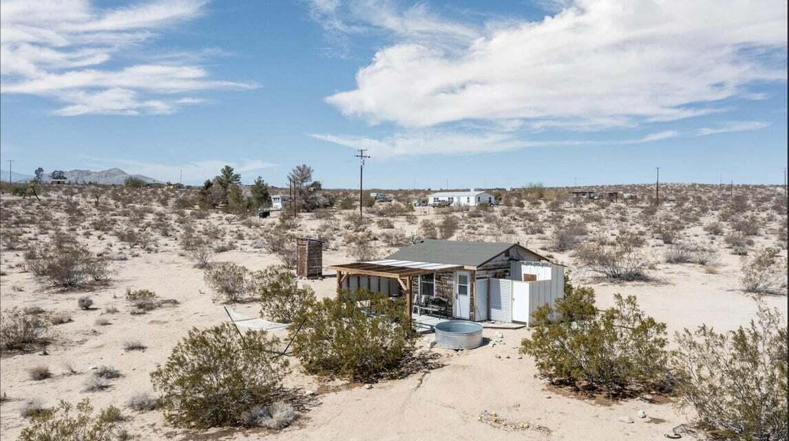 63637 Gemini Road Joshua Tree, CA 92252 - Photo 1 of 22 a view of a town with large trees