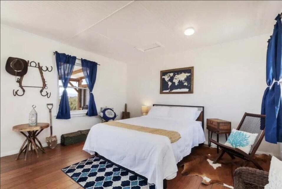 63637 Gemini Road Joshua Tree, CA 92252 - Photo 11 of 22 a bedroom with a bed and furniture