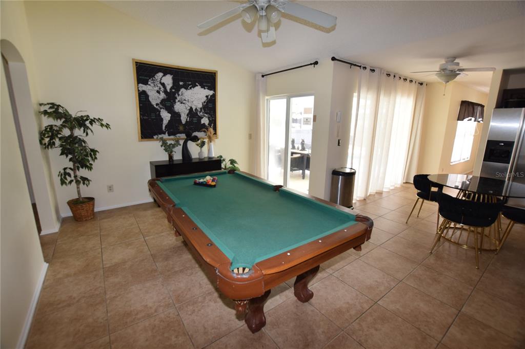 7748 Indian Ridge Trail South Kissimmee, FL 34747 - Photo 30 of 37 a room with pool table and windows