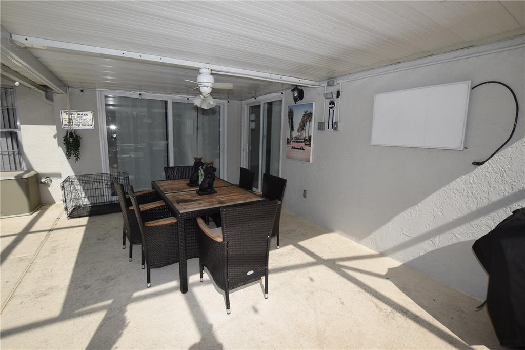 7748 Indian Ridge Trail South Kissimmee, FL 34747 - Photo 10 of 37 a view of a dining room with furniture