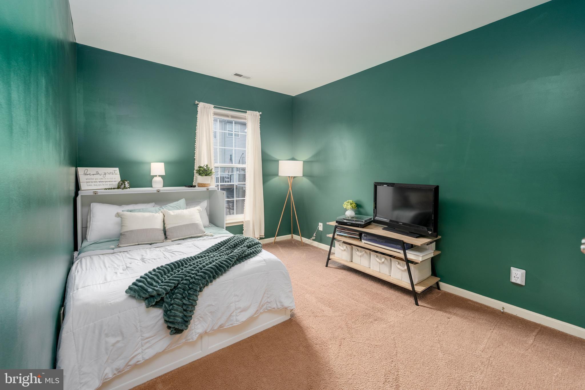 688 Luthardt Road Baltimore, MD 21220 - Photo 15 of 32 a bedroom with a bed and a flat screen tv