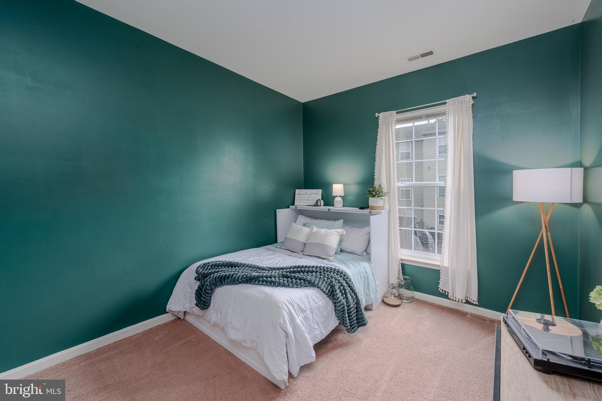 688 Luthardt Road Baltimore, MD 21220 - Photo 16 of 32 a bedroom with a bed and a mirror