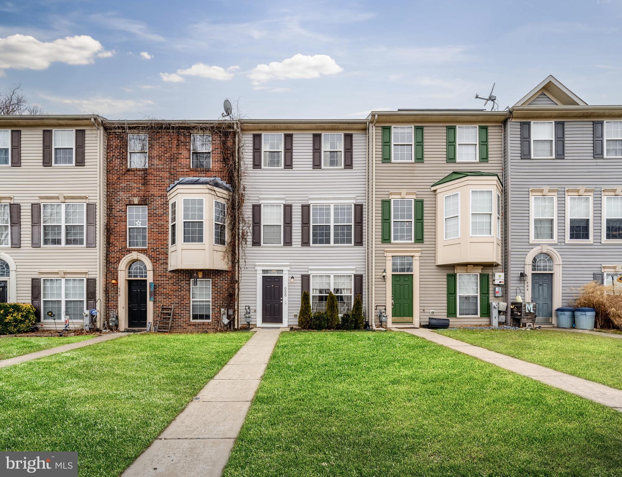 688 Luthardt Road Baltimore, MD 21220 - Photo 2 of 32 a front view of a house with a yard