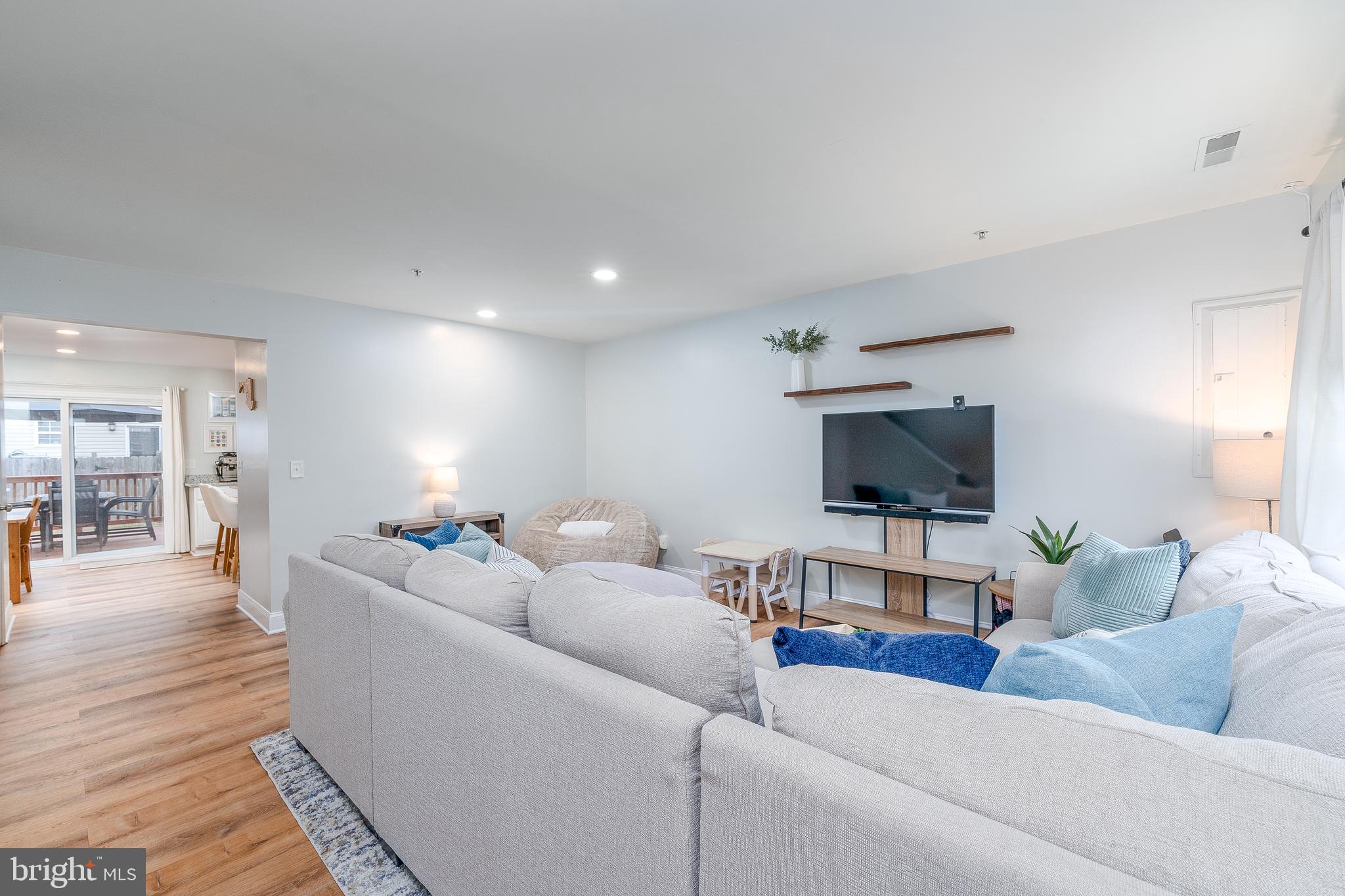 688 Luthardt Road Baltimore, MD 21220 - Photo 3 of 32 a living room with furniture and a flat screen tv