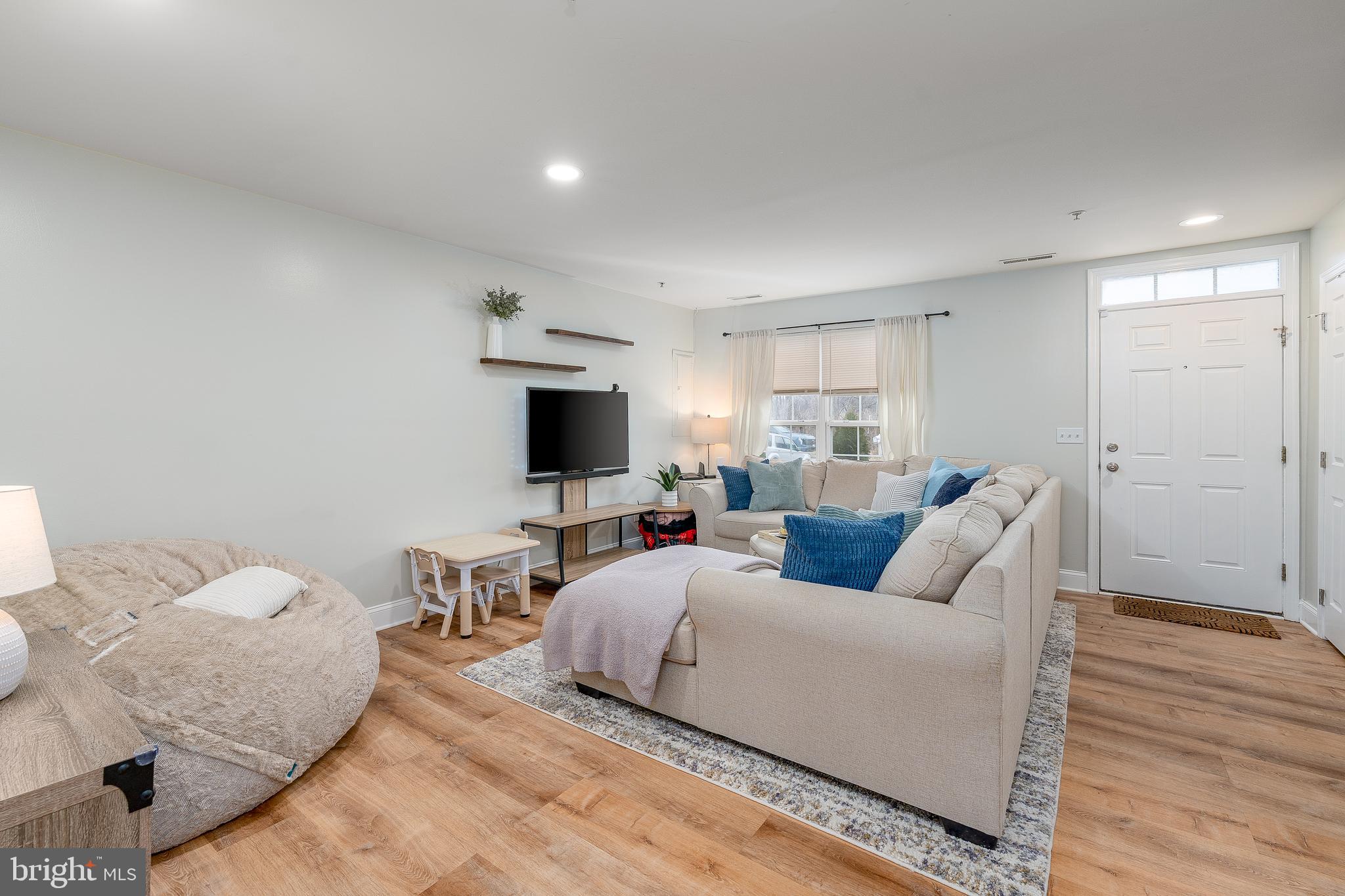 688 Luthardt Road Baltimore, MD 21220 - Photo 4 of 32 a living room with furniture and a flat screen tv