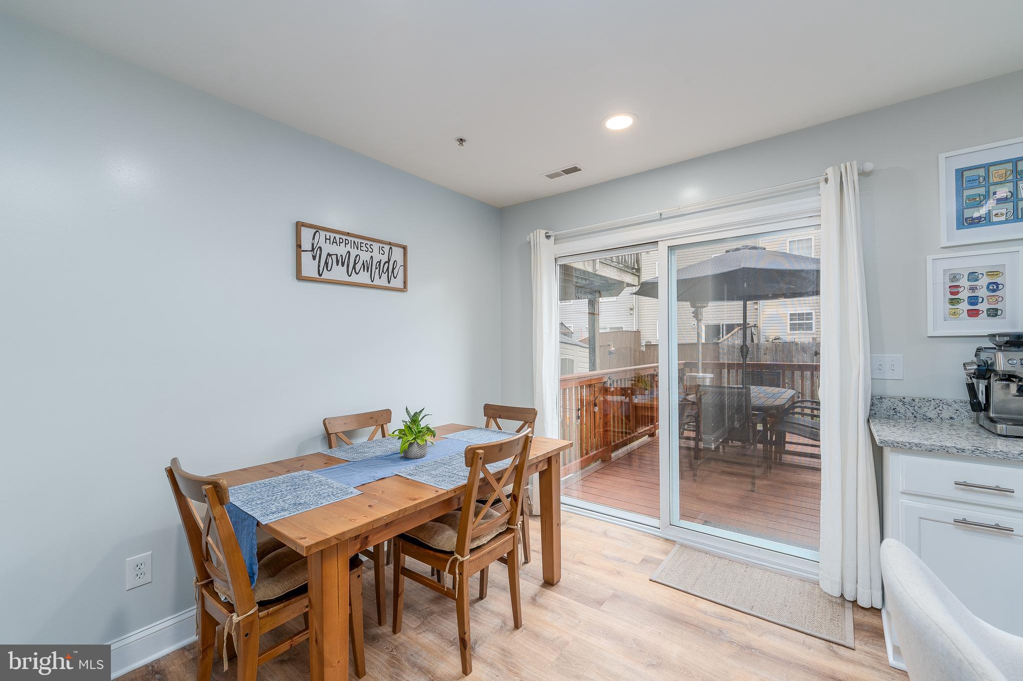 688 Luthardt Road Baltimore, MD 21220 - Photo 10 of 32 a view of a dining room with furniture wooden floor and next to a window