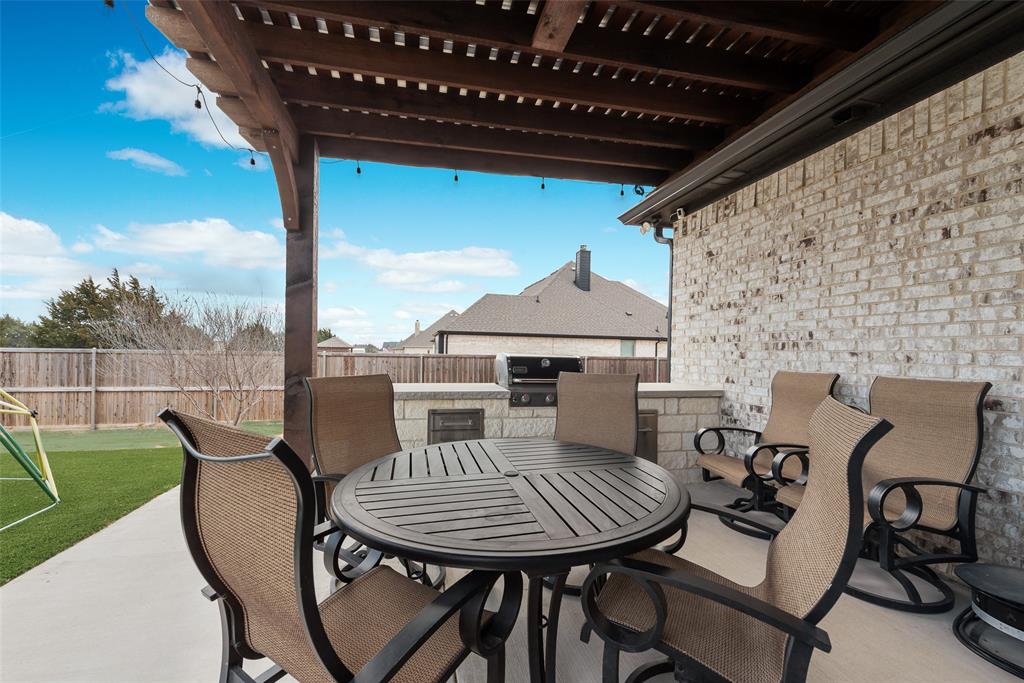 4041 Richard Road Midlothian, TX 76065 - Photo 11 of 36 a view of a chairs and table in the patio