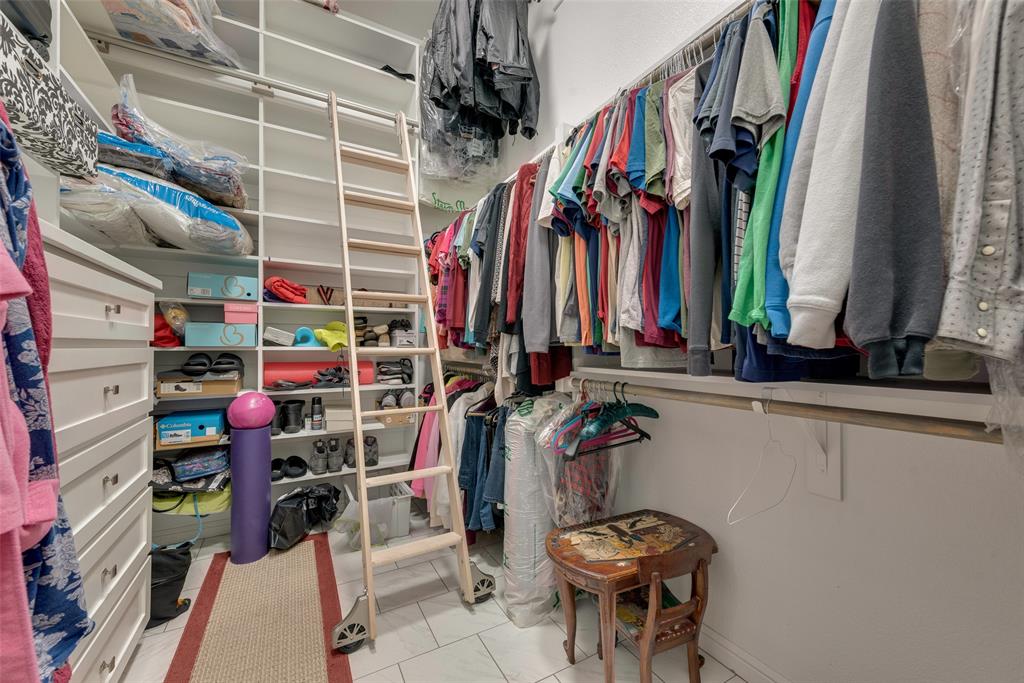4041 Richard Road Midlothian, TX 76065 - Photo 13 of 36 a view of walk in closet with clothes and shoes
