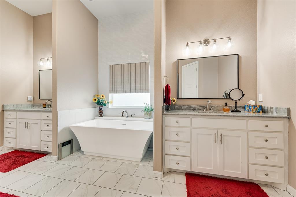 4041 Richard Road Midlothian, TX 76065 - Photo 15 of 36 a spacious bathroom with a double vanity sink mirror and