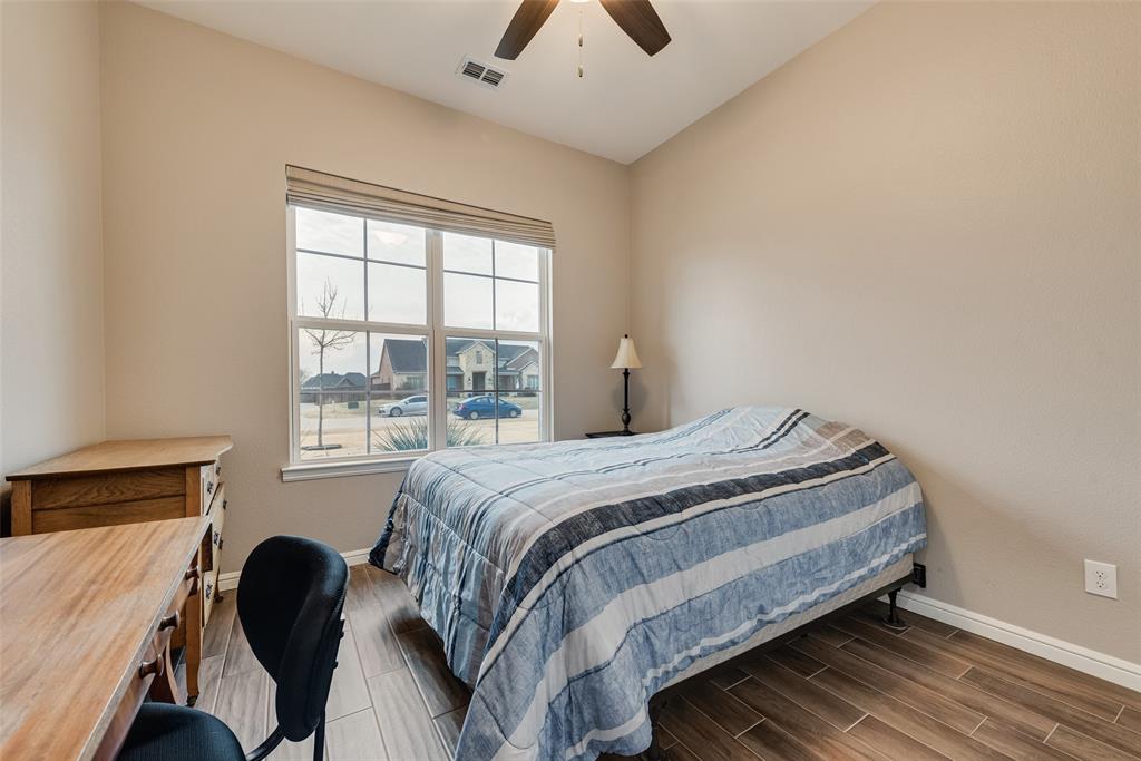 4041 Richard Road Midlothian, TX 76065 - Photo 25 of 36 a bedroom with a bed and a large window