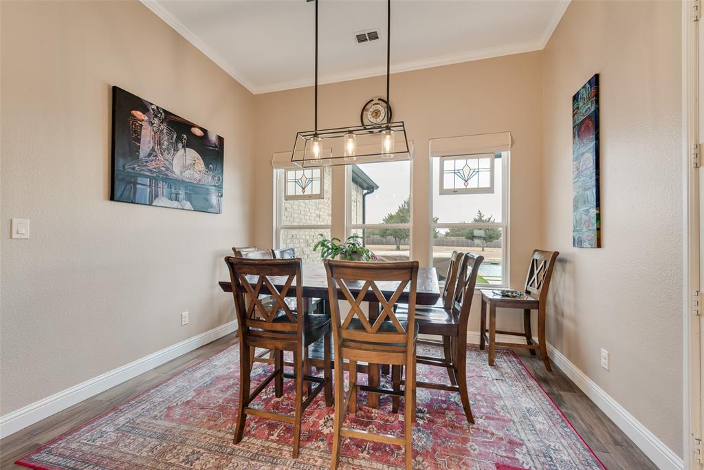 4041 Richard Road Midlothian, TX 76065 - Photo 27 of 36 a view of a dining room with furniture window and wooden floor