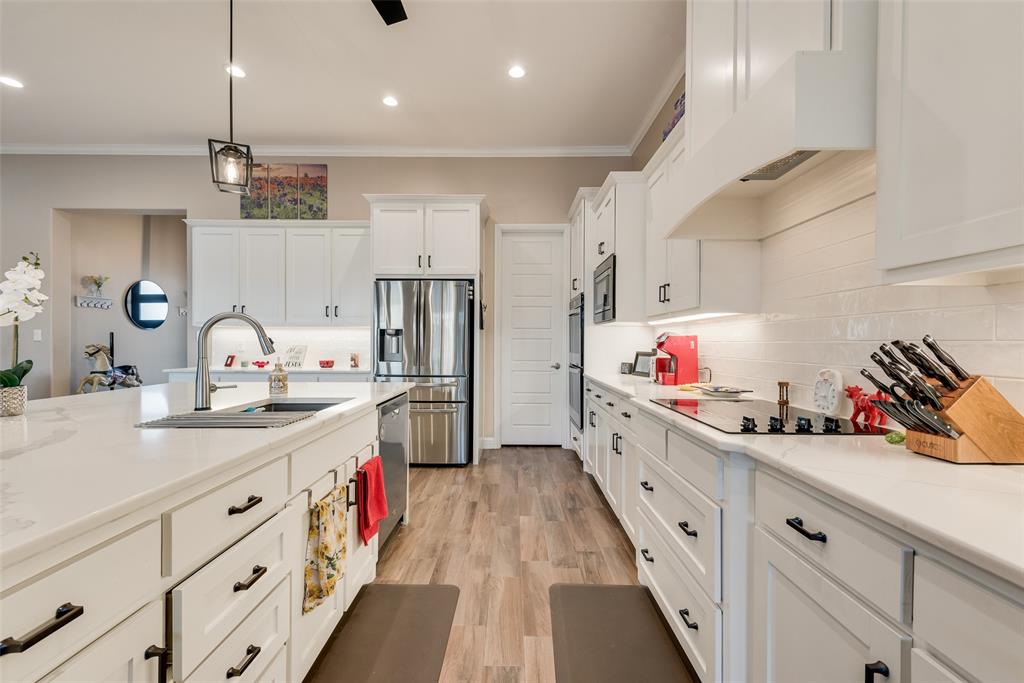 4041 Richard Road Midlothian, TX 76065 - Photo 30 of 36 a large kitchen with cabinets a sink and dishwasher