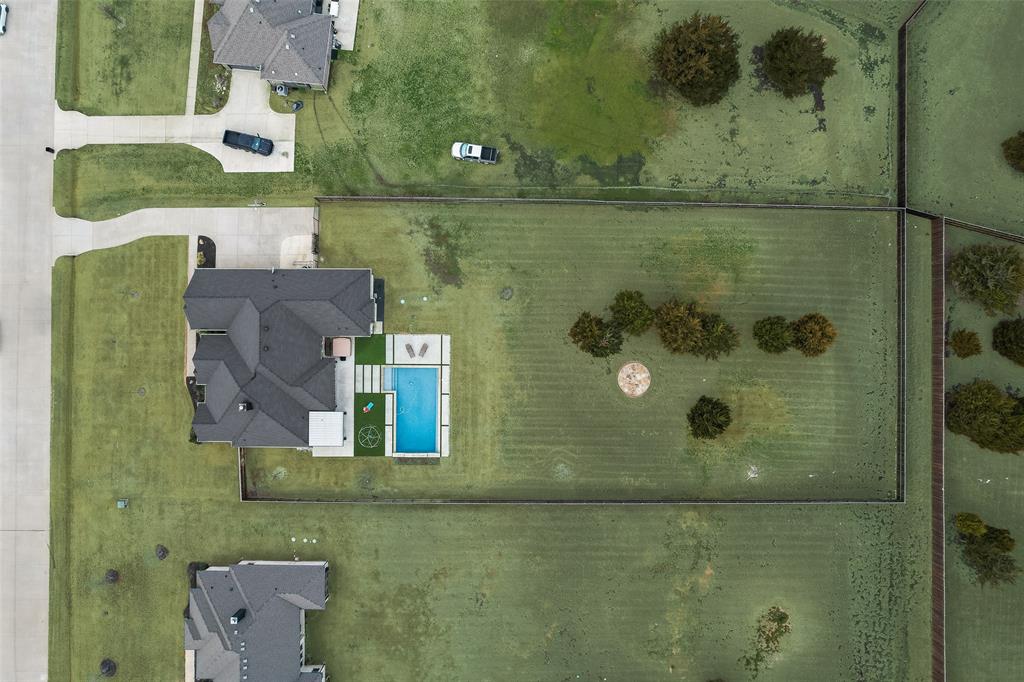 4041 Richard Road Midlothian, TX 76065 - Photo 36 of 36 an aerial view of a house with a yard
