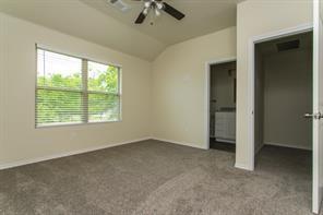 690 Union Street, Unit 2 Bonham, TX 75418 - Photo 9 of 12 an empty room with a empty space and windows