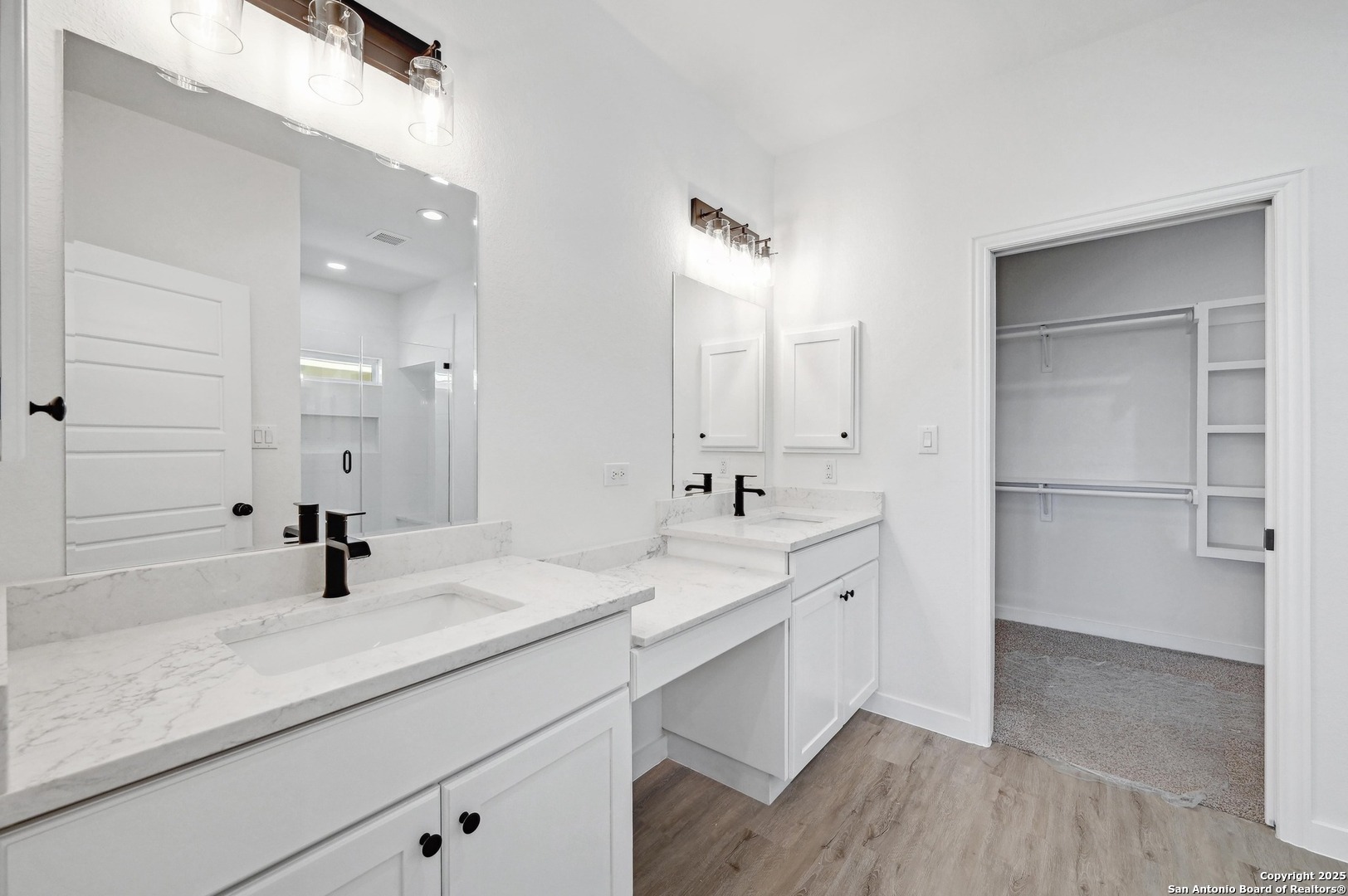 236 Peter Kleid Loop Blanco, TX 78606 - Photo 14 of 21 a bathroom with a double vanity sink a mirror and shower