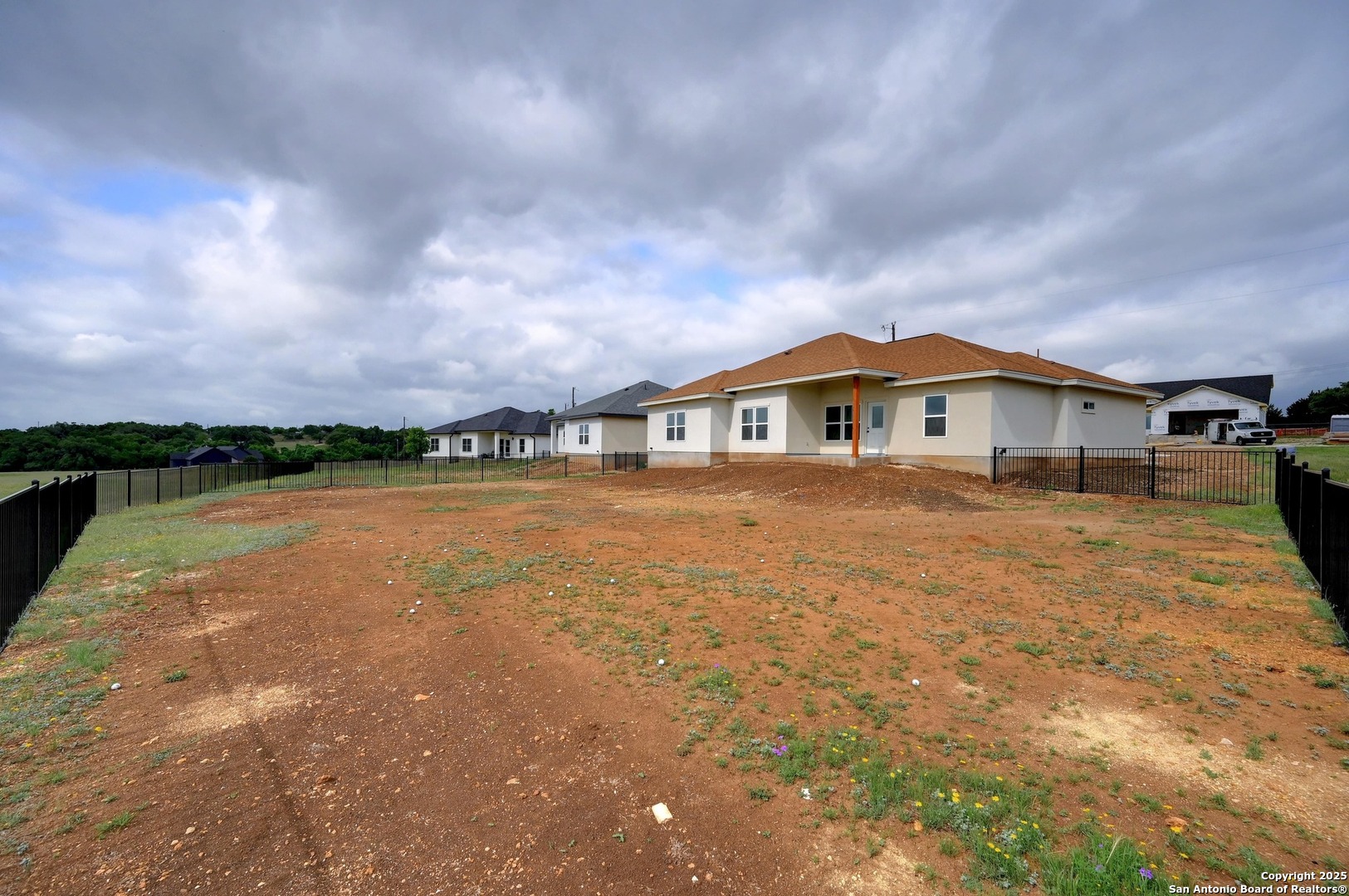 236 Peter Kleid Loop Blanco, TX 78606 - Photo 21 of 21 a view of house with garden and lake