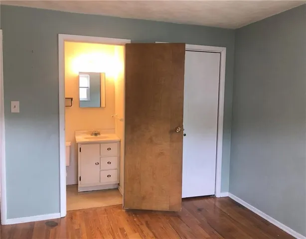 a view of cabinets and wooden floor
