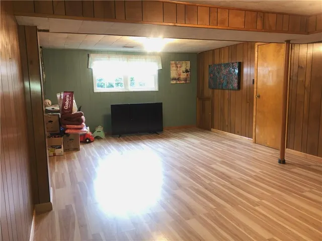 a view of a room with wooden floor