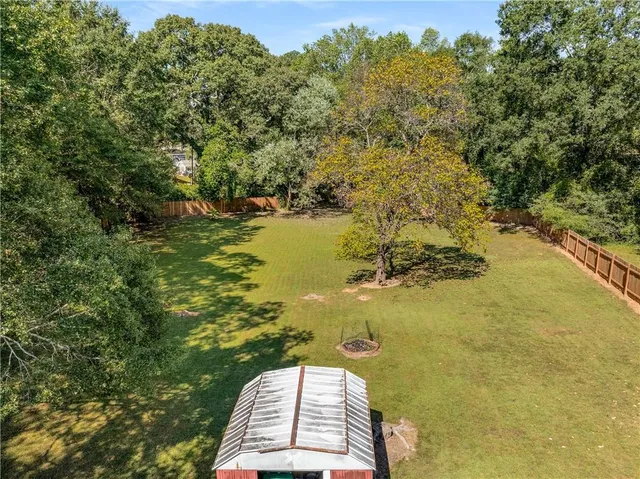 a view of a lake with a yard