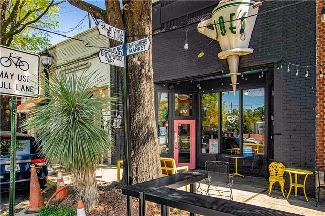 a view of street with sitting area