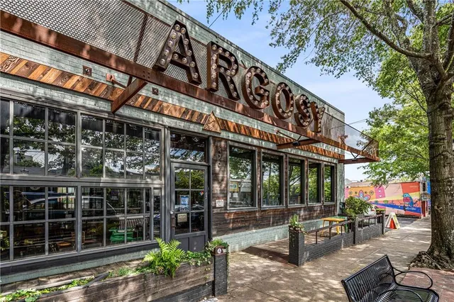 a front view of a building with sitting space