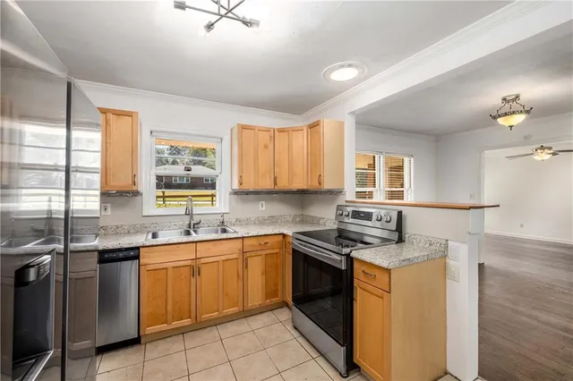 a kitchen with a sink stove and cabinets