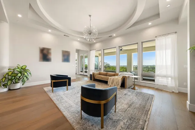 a kitchen with stainless steel appliances granite countertop sink stove and refrigerator