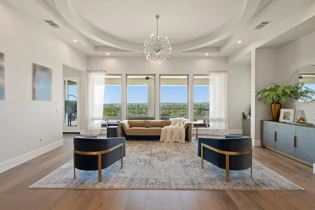 a kitchen with stainless steel appliances granite countertop a stove and white cabinets