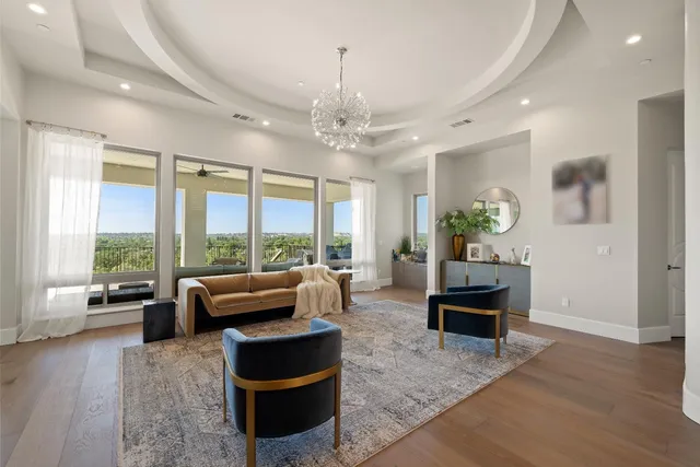 a kitchen with stainless steel appliances kitchen island a stove a sink and white cabinets