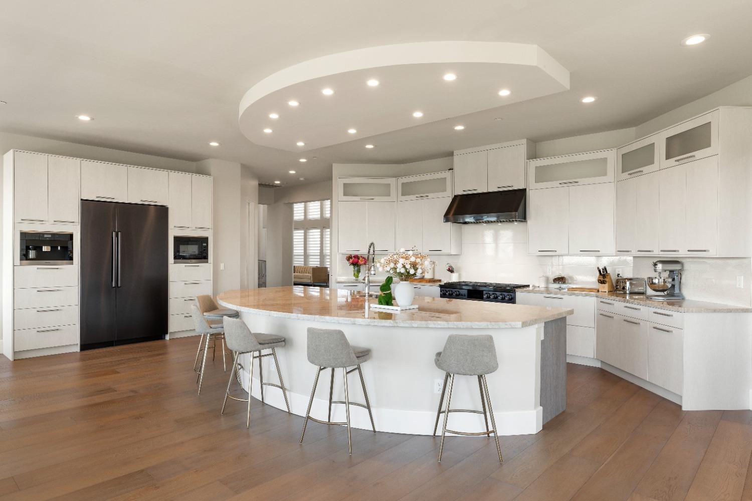 4023 Cornwall Court Rocklin, CA 95677 - Photo 19 of 85 a kitchen with stainless steel appliances kitchen island granite countertop a dining table chairs refrigerator and microwave